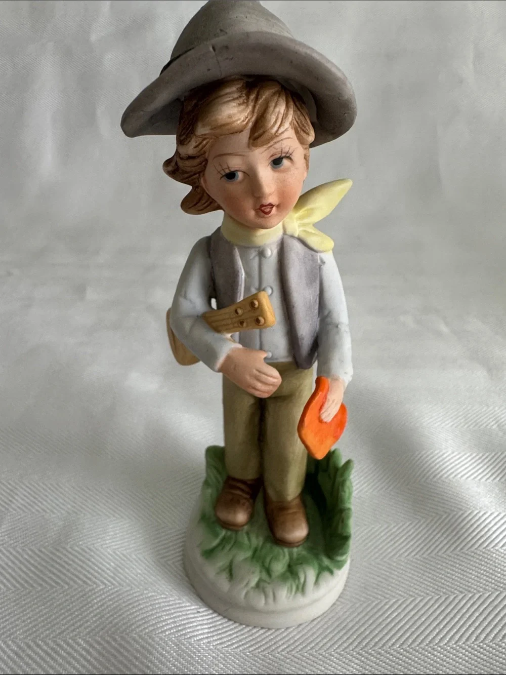 Hand-Painted Porcelain Boy Figurine in Neutral and Orange